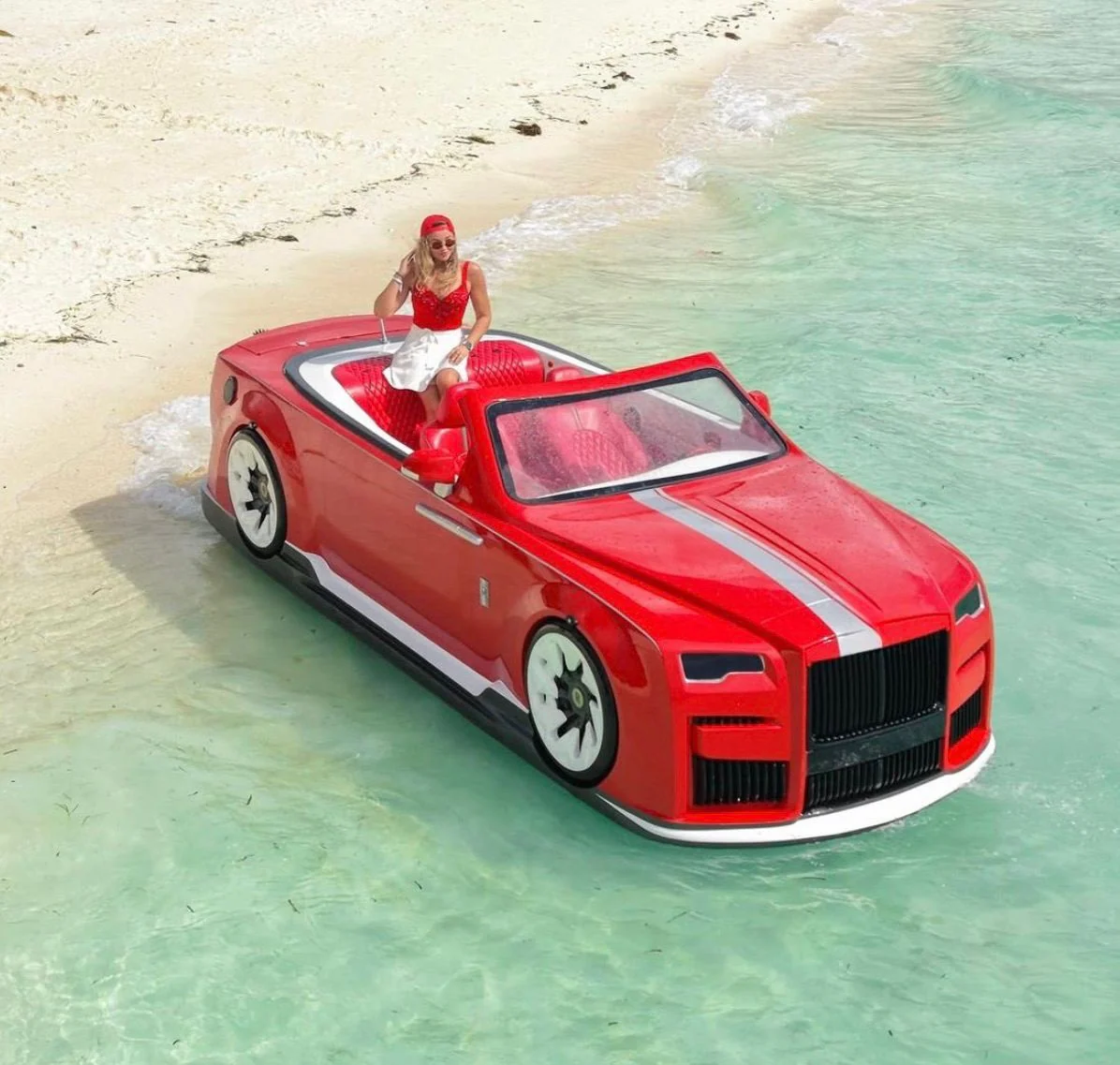 Red EDRIVE luxury watercar on clear tropical water